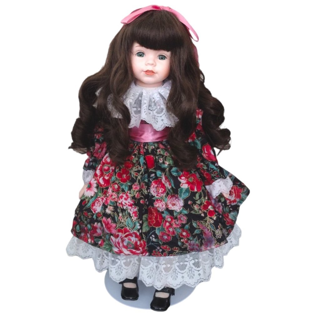 Brown curly hair collectible doll.